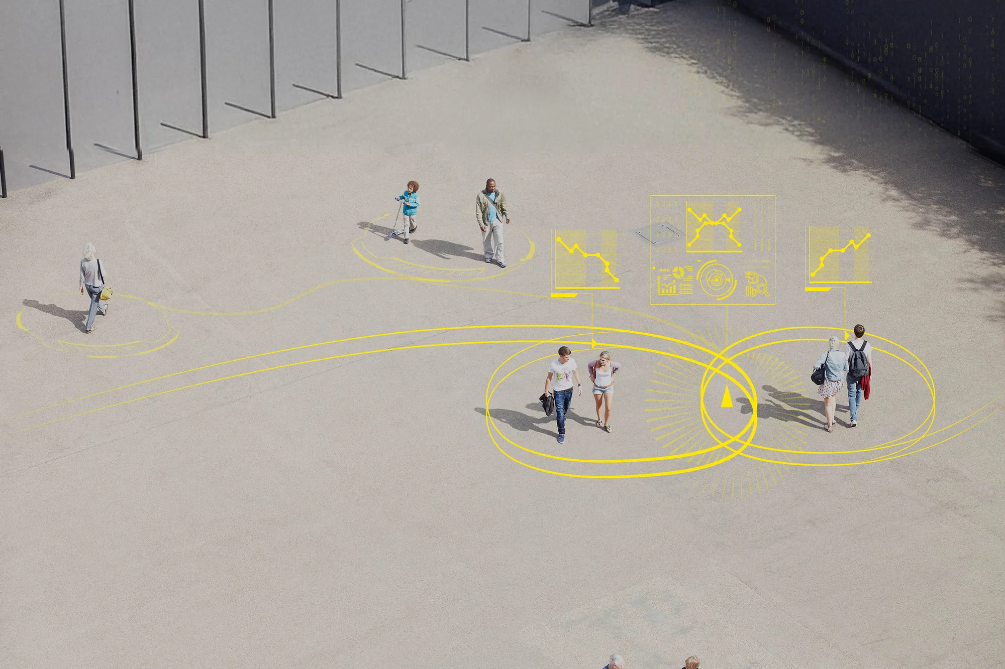 people walking across a plaza seen from above
